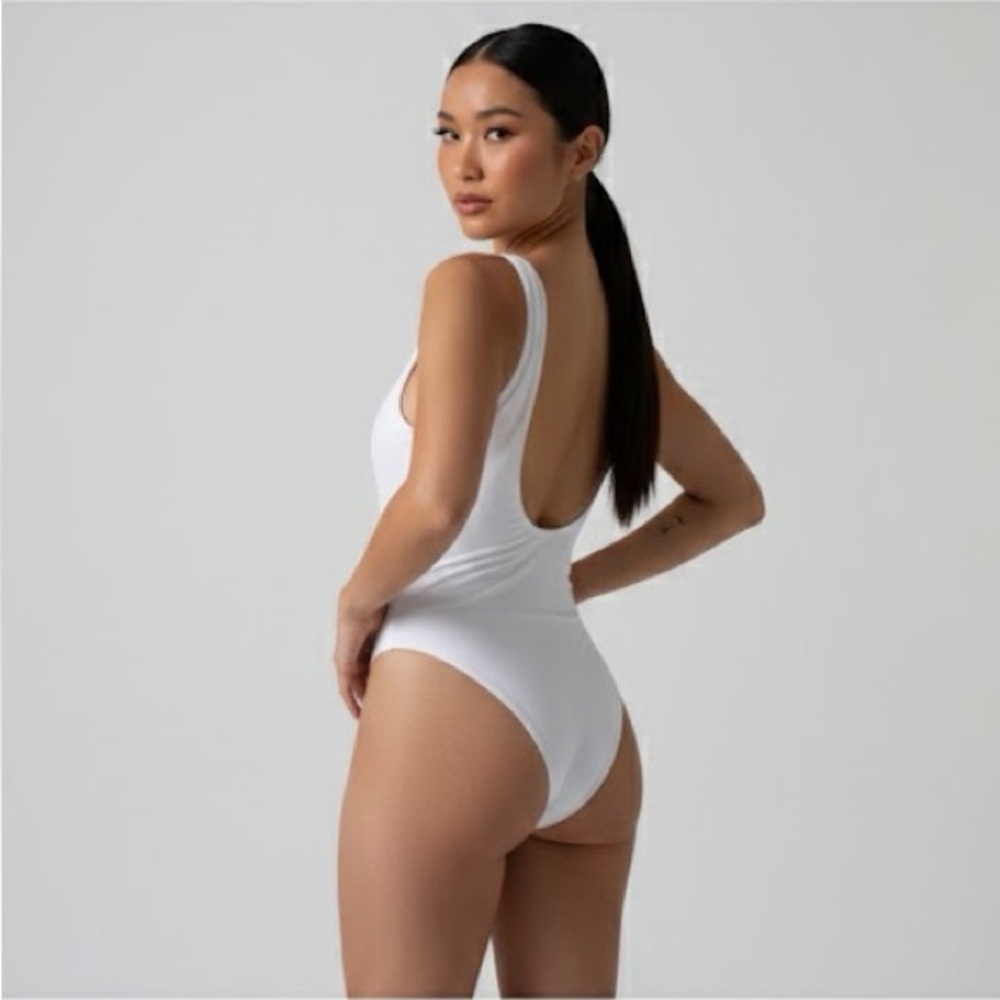 White One-Piece Swimsuit with Deep V-Neck and High-Cut Legs